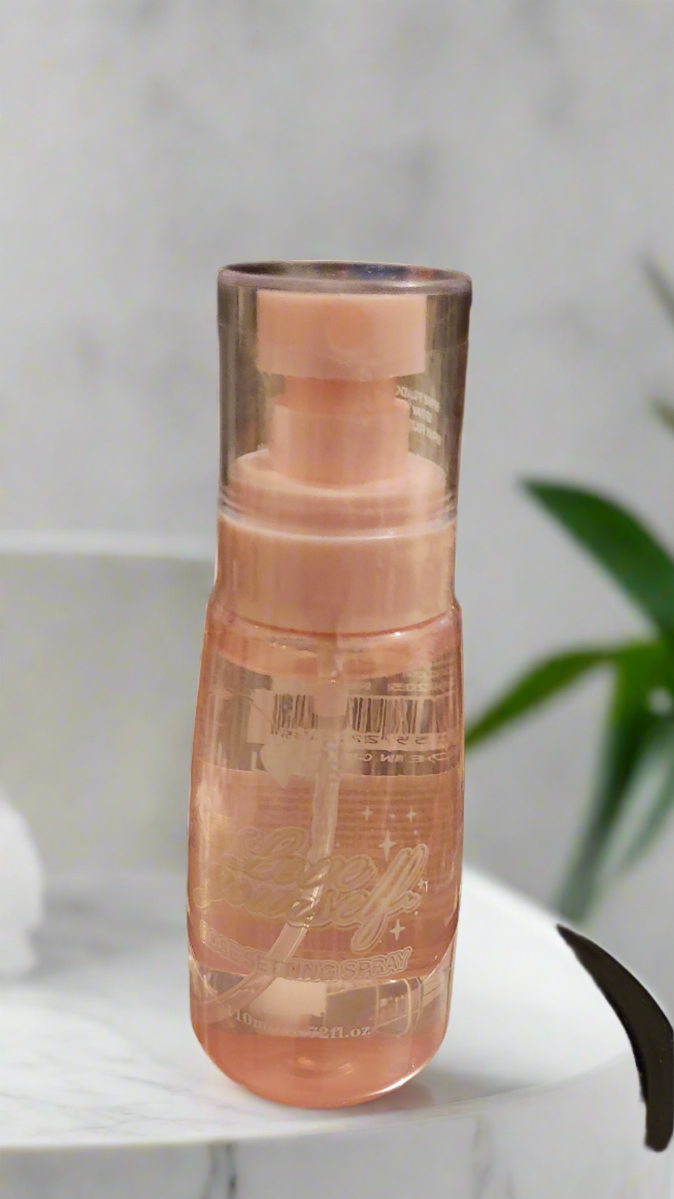 Spray fixateur à l'eau de rose